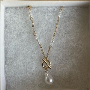 Gold pearl charm toggle necklace